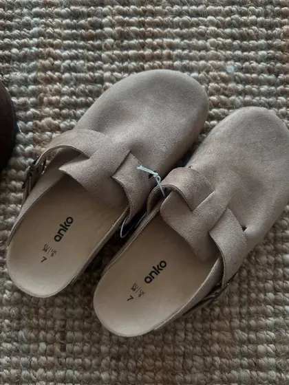 A top-down view of the taupe clogs, showing the soft material and classic design. These are always a popular item when I open orders.