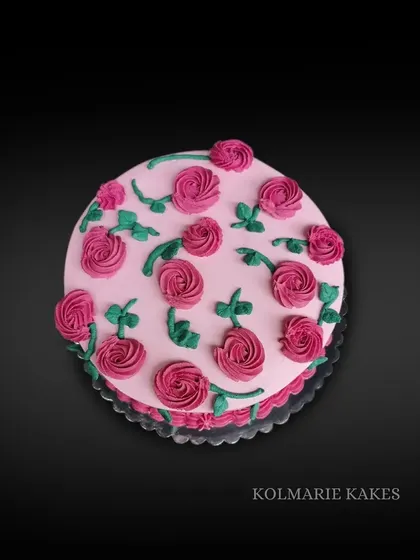 Sometimes the little things are the most beautiful. This simple cake is decorated with a pattern of piped buttercream roses for a sweet and classic look.