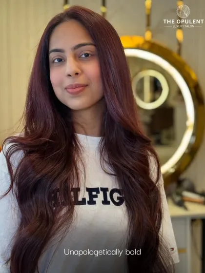 Unapologetically bold. This client is rocking a rich, all-over burgundy color. The shade is deep and even from root to tip, giving her a powerful and stunning new identity.