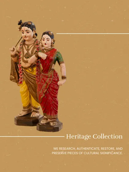 A pair of wooden sculptures depicting Radha and Krishna. We research, authenticate, restore, and preserve pieces of cultural significance as part of our Heritage Collection.