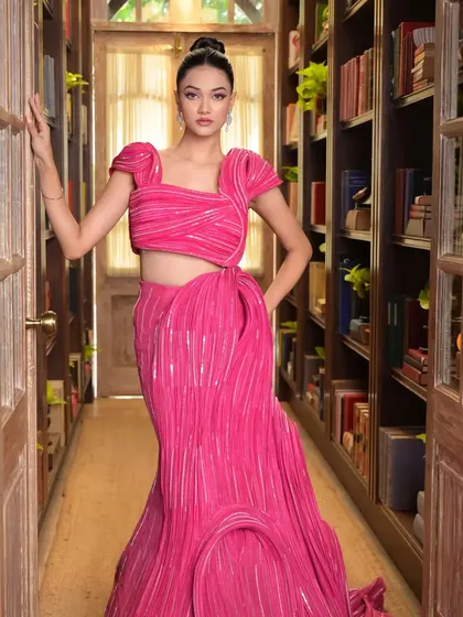 This shot in a library corridor shows how the hairstyle and outfit create a strong visual narrative. The classic top knot adds an element of timeless sophistication.