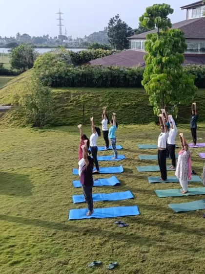 Another angle of our outdoor yoga class, showing participants fully engaged in their practice. The fresh air and natural light make these sessions a highlight for many of our guests.