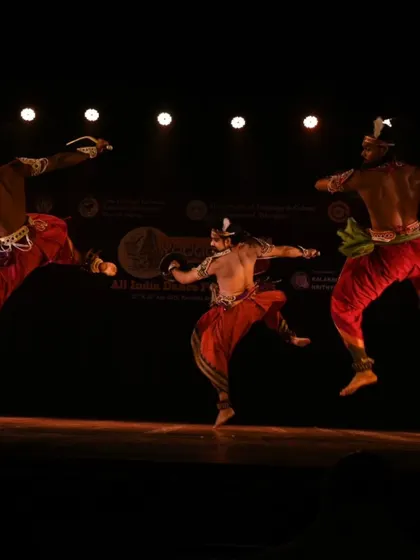 A recreation of the iconic mid-air jump from a different angle, showing the consistent power and technique of my troupe during a Mayurbhanj Chhau performance.