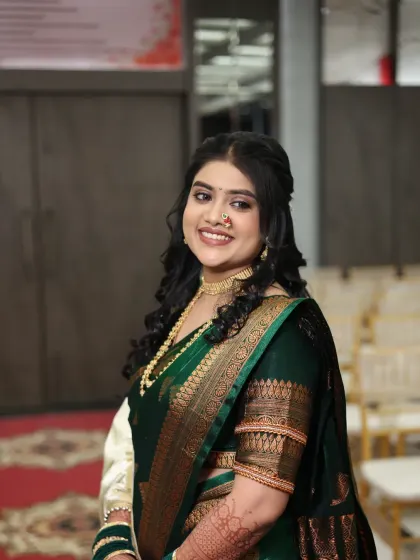 A happy bride at her function. The makeup is designed to look fresh and beautiful throughout the long hours of celebration.