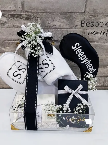 Another view of the bespoke "Sleepyhead" memento box, with monogrammed slippers and an eye mask, perfect for pre-wedding relaxation.