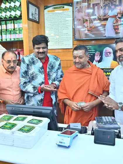 Making the first sale during a showroom inauguration. It is considered a lucky start for the business, and I am always happy to do it.