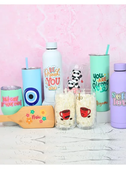 A dreamy collection of my personalized drinkware and accessories. This image features the Bora Bora tumbler, Aqualite bottle, coffee glasses, and a custom hairbrush in various pastel shades.