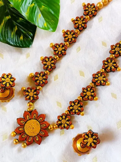 These are additional images of the floral necklace sets in various colors, showcasing the wide range of options available for bulk purchase.