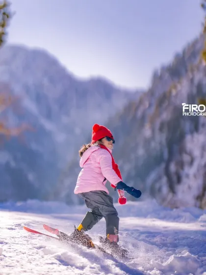 Another shot of my daughter skiing, this time with the majestic snow-covered mountains in the background. This shows the potential of a destination photoshoot.