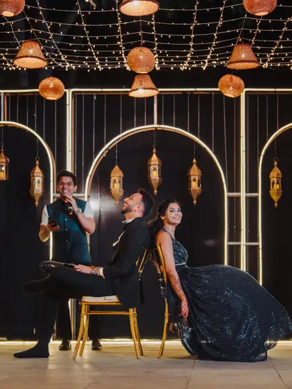 The couple participates in the classic "shoe game" on their Sangeet stage, a fun and interactive way to entertain guests and share their story.