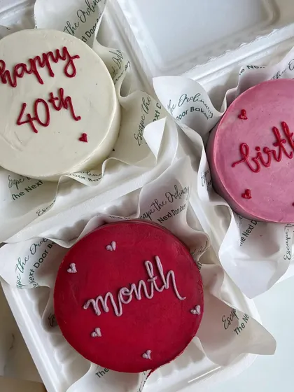 A trio of colorful buttercream mini cakes, each with a simple, heartfelt message. These are perfect for celebrating a birthday month or a special milestone like turning 40.