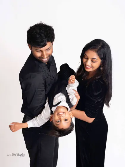 Let the fun begin! I encourage playful and energetic moments during my family shoots. This shot of a little boy being held upside down by his parents captures the pure, chaotic joy of family life.