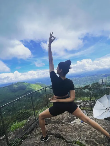 On a clifftop in Munnar, with the world stretching out below, even a simple warrior variation feels powerful. The expansive view and open sky encourage a sense of freedom and strength in the body and mind.