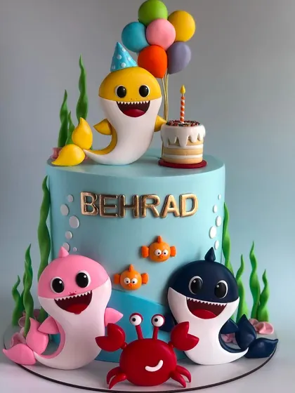 A sweet Baby Shark cake perfect for a first birthday. Learn to model the whole shark family with their signature cheerful expressions.