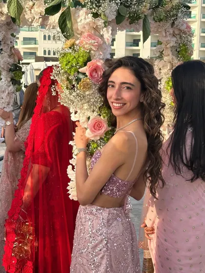 A candid smile during a beautiful daytime wedding ceremony in Dubai. It's a joy to be part of such special moments.