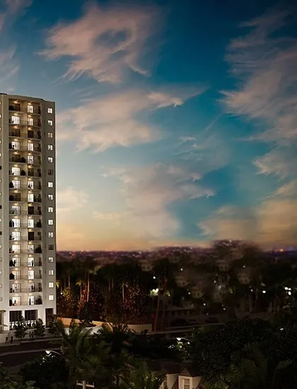 The facade of the Machani Svasa Apartments set against a dramatic sunset. Our design aims to create buildings that are not just functional but also contribute beautifully to the city's skyline.