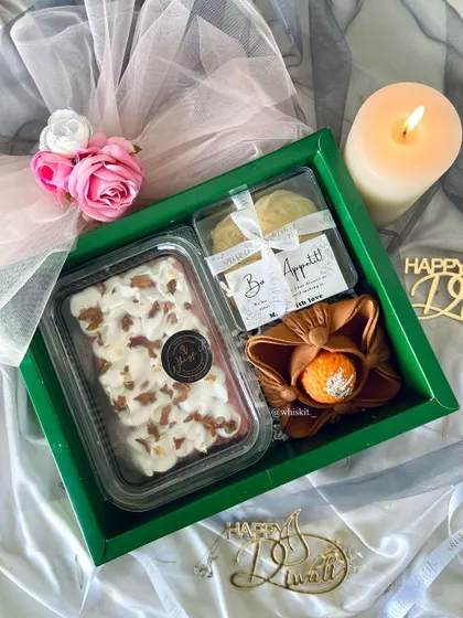An inside look at one of my festive Diwali hampers. This one includes a Rose Milk Tres Leches tub, Danish butter cookies, and a decorative diya.