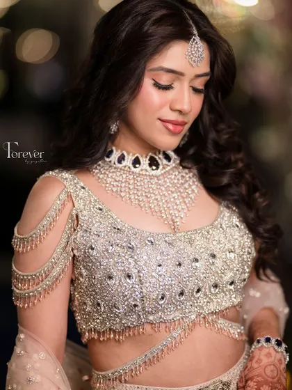 A detailed shot of Mahima's reception makeup. The focus is on her eyes, with a soft shimmer and defined lashes, creating a look that is both captivating and elegant.