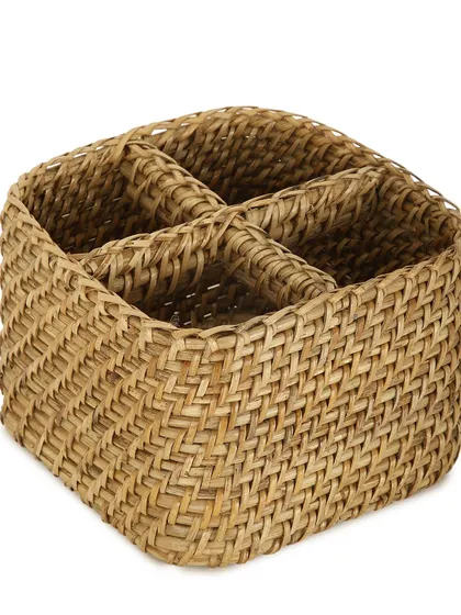 A handwoven utility holder with four compartments. This sturdy and compact organizer is perfect for holding cutlery on a dining table, organizing stationery on a desk, or keeping makeup brushes tidy on a vanity.