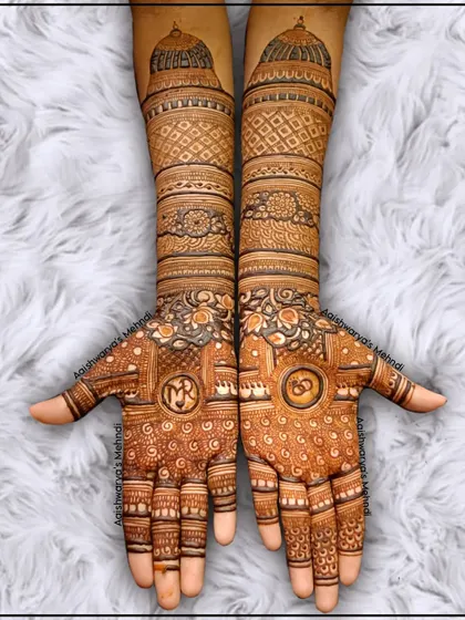 A classic full bridal design with incredible detail. The palms feature personalized initials, and the arms are covered in dense, traditional patterns including architectural domes.