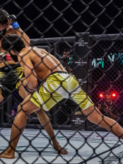 Clinch work against the cage. Every position in MMA presents both danger and opportunity. This fight was a showcase of heart and durability.