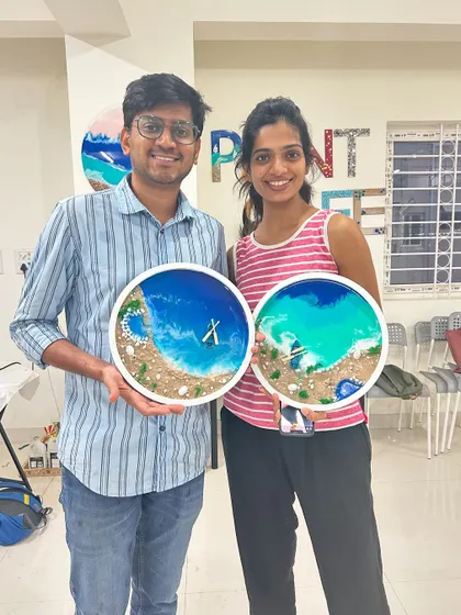 This couple created two different styles of beach resin art during their workshop session.