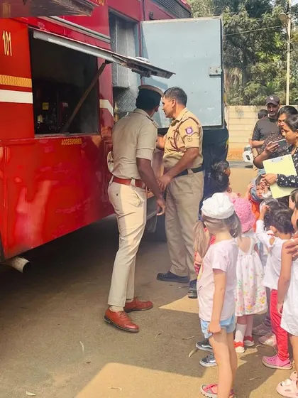 The children get an up-close look at the fire truck's equipment, asking questions and learning from the firefighters.