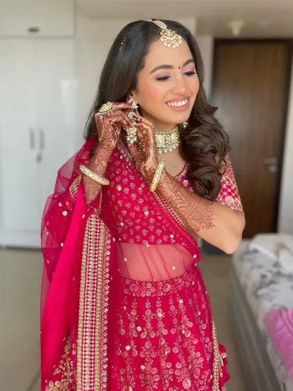 A candid shot of the happy bride, her hair looking perfect.