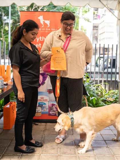 A pet parent checks out the goodies from Heads Up For Tails, one of the sponsors of the breakfast event. Collaboration is key to creating successful fundraisers.