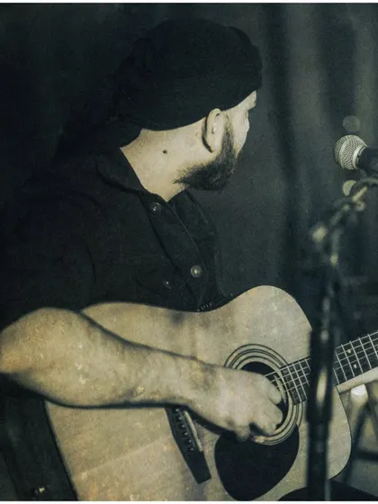 A throwback to an unplugged set of my original songs. This photo has a timeless, rustic feel that reflects the honest and raw nature of my music.