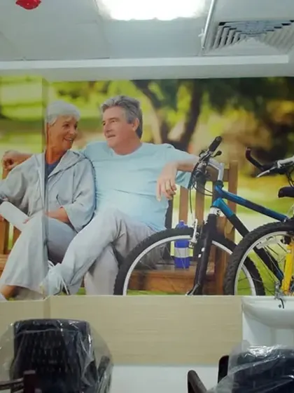 This wallpaper featuring an active senior couple was chosen for a clinic to promote a positive and healthy image of aging. It helps create an uplifting and encouraging environment for patients of all ages.