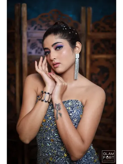 This is the work of one of my talented students. A beautiful cocktail look with a pop of purple on the eyes, showing their command of color and blending techniques.