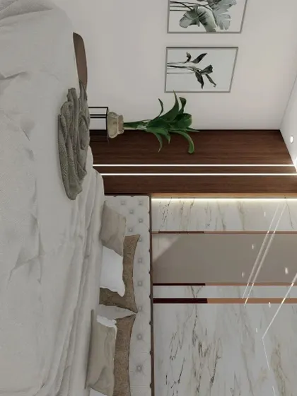 A view from the foot of the bed, highlighting the tufted headboard and the elegant wardrobe with marble and rose gold inlay details.