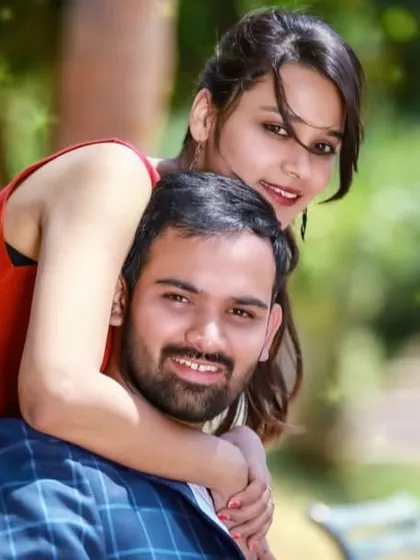 A happy and bright couple portrait taken during an outdoor pre-wedding session.