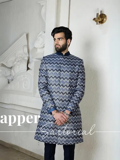 Dapper Sartorial. A full-length look at the chevron-patterned kurta, showcasing its modern yet traditional silhouette that is perfect for the wedding season.
