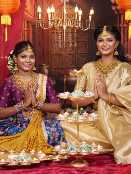 A festive moment captured perfectly. Both half sarees are designed to be grand and celebratory, perfect for a festival like Diwali.