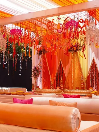 Comfortable and stylish seating is key for any event. We arranged these low, cushioned sofas with bolsters to provide a relaxed and informal seating area for guests to enjoy the Haldi festivities.