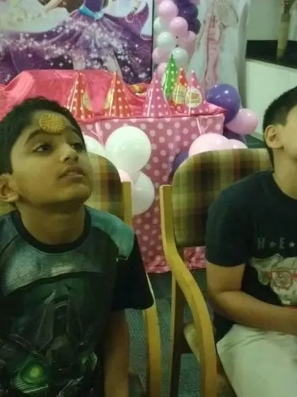 A close-up of the intense focus during our biscuit-on-the-forehead challenge. It's a simple game that is surprisingly tricky and hilarious for both the participants and the audience.