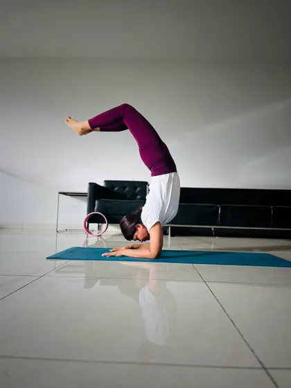 A moment of focus in Vrschikasana (Scorpion Pose). This inversion is a test of strength, flexibility, and discipline, all coming together in one powerful shape.