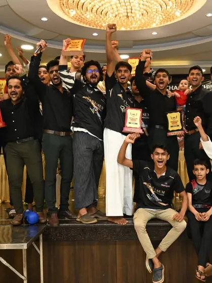 The thrill of victory. The entire team celebrates on stage with their trophies after a successful tournament. This is the reward for all the hard work and a testament to our team spirit.