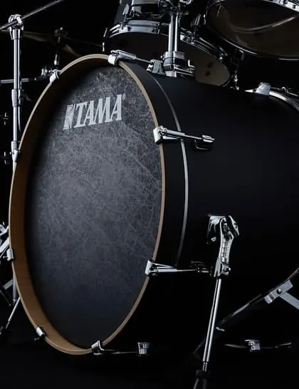 A close-up of the Tama bass drum, featuring the black fiber laminated head for a distinct look and sound.