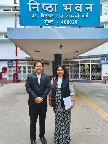 Outside Nishta Bhavan with my colleague Aditya Pratap. Our work is driven by 'Nishta' (dedication) to our cause of fighting for justice.