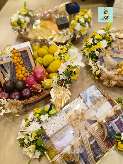 A full view of the fresh and vibrant Roka hampers I created. I love combining fresh fruit, gourmet foods, and stunning floral arrangements to celebrate a new beginning for a couple.