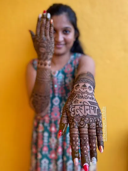And here is the 'dulhaniya' (bride)! A fun shot focusing on the back of the hand, where we've written "Abhishek's Dulhaniya" to celebrate the groom.