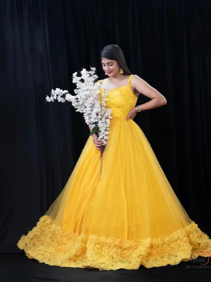 A full view of our yellow ruffle gown, a perfect rental for pre-wedding shoots, maternity photos, or any function.