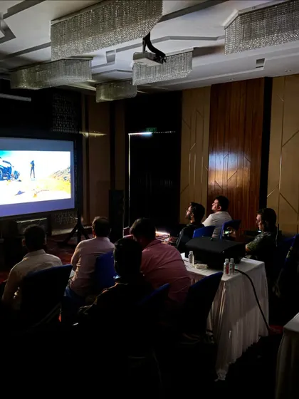 The training environment is set up to replicate a real-world home cinema scenario. Here, participants watch a film clip to critically listen and evaluate the results of their calibration work in a practical application.