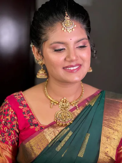 A three-quarter profile shot showing how the makeup beautifully sculpts and defines the face, creating a soft yet defined look.