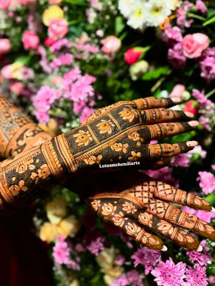 The back of the hands, featuring a beautiful floral design that complements the intricate work on the palms.