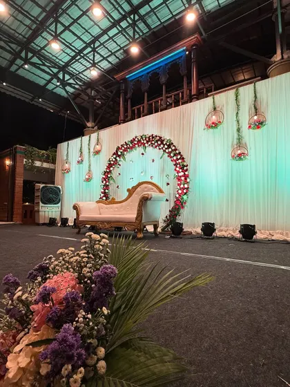 Another view of the simple engagement stage, showing the hanging glass globes with candles that add a touch of romance.