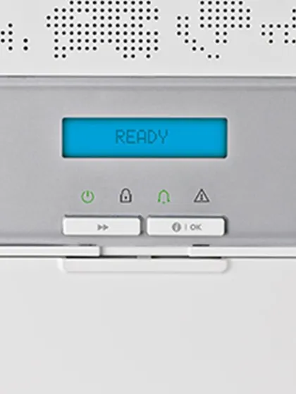 This is the central control panel, featuring a clear display and simple buttons, indicating when the system is armed and ready.